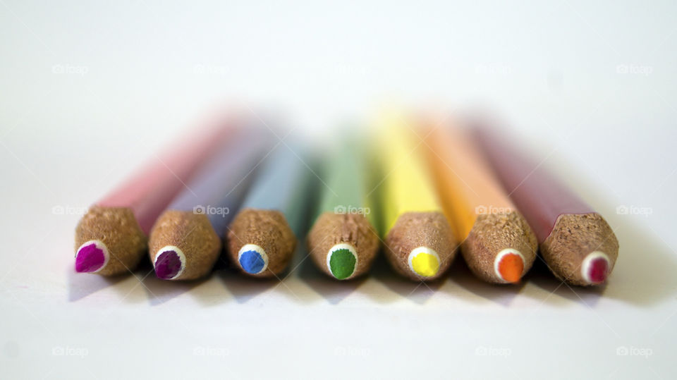 Colored pencils in a row