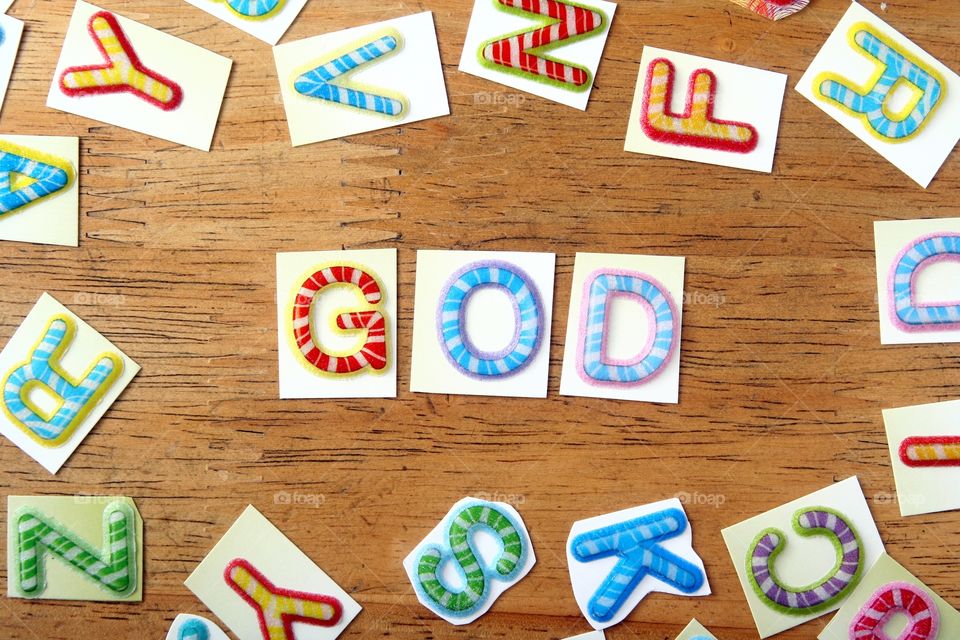 word God in colorful letters. the word God spelled in colorful letters