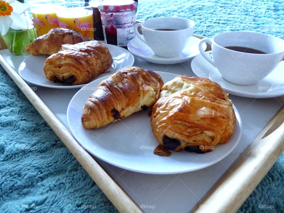 Croissants and coffee served on tray