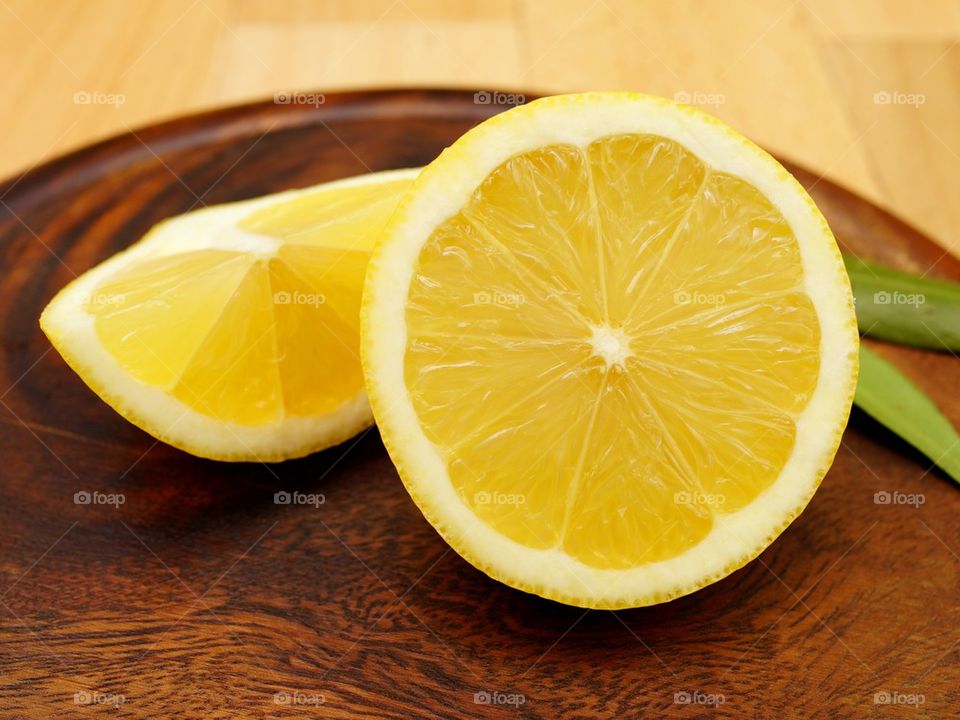 Halved lemon on wood