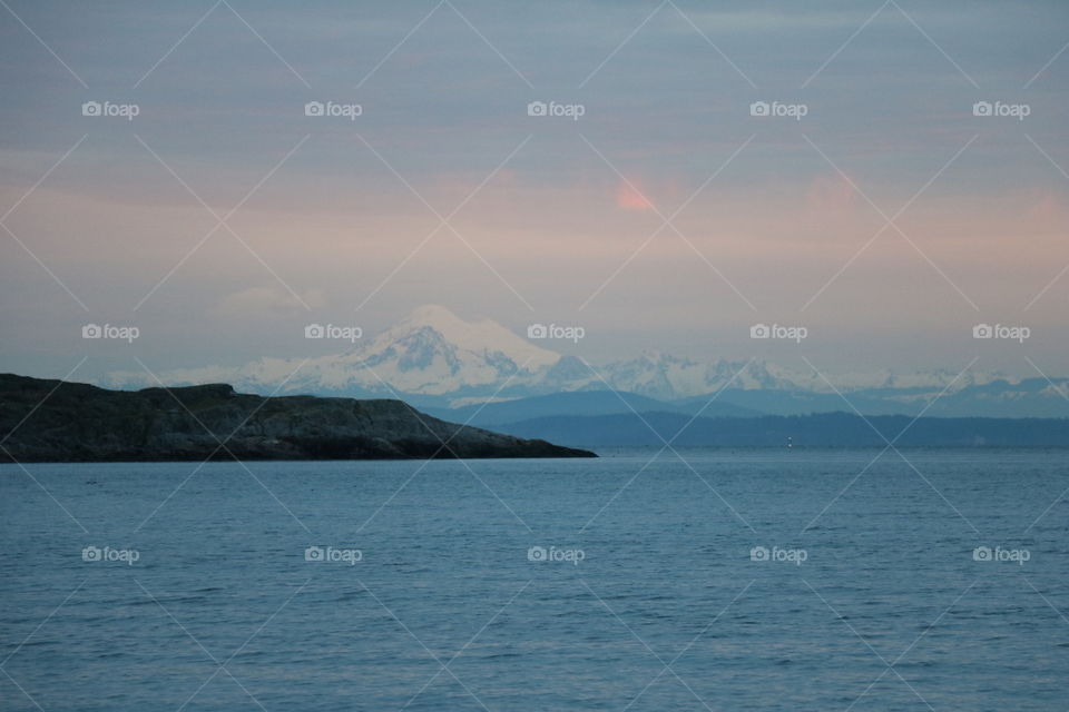 Mt Baker rising above the ocean on dawn