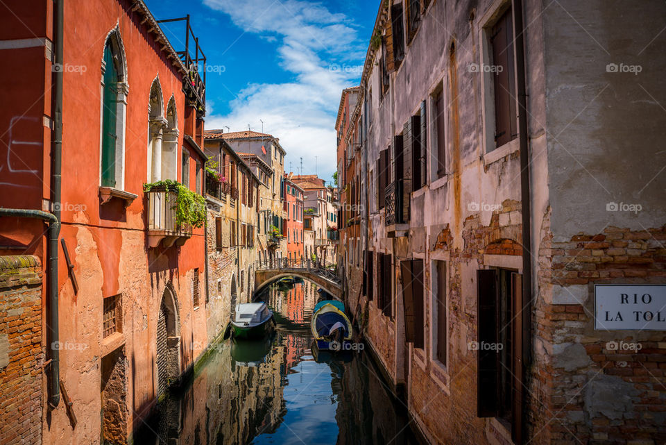 View of canal along buildings in Venice