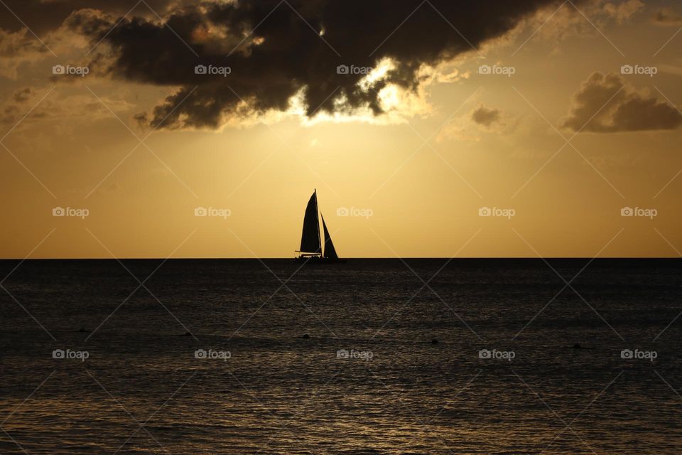 sailing at sunset in caribbean sea