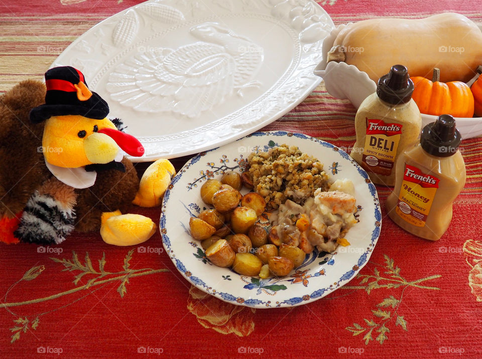 Thanksgiving plate of turkey in a creamy French’s deli and honey mustard sauce with stuffing and roasted potatoes.