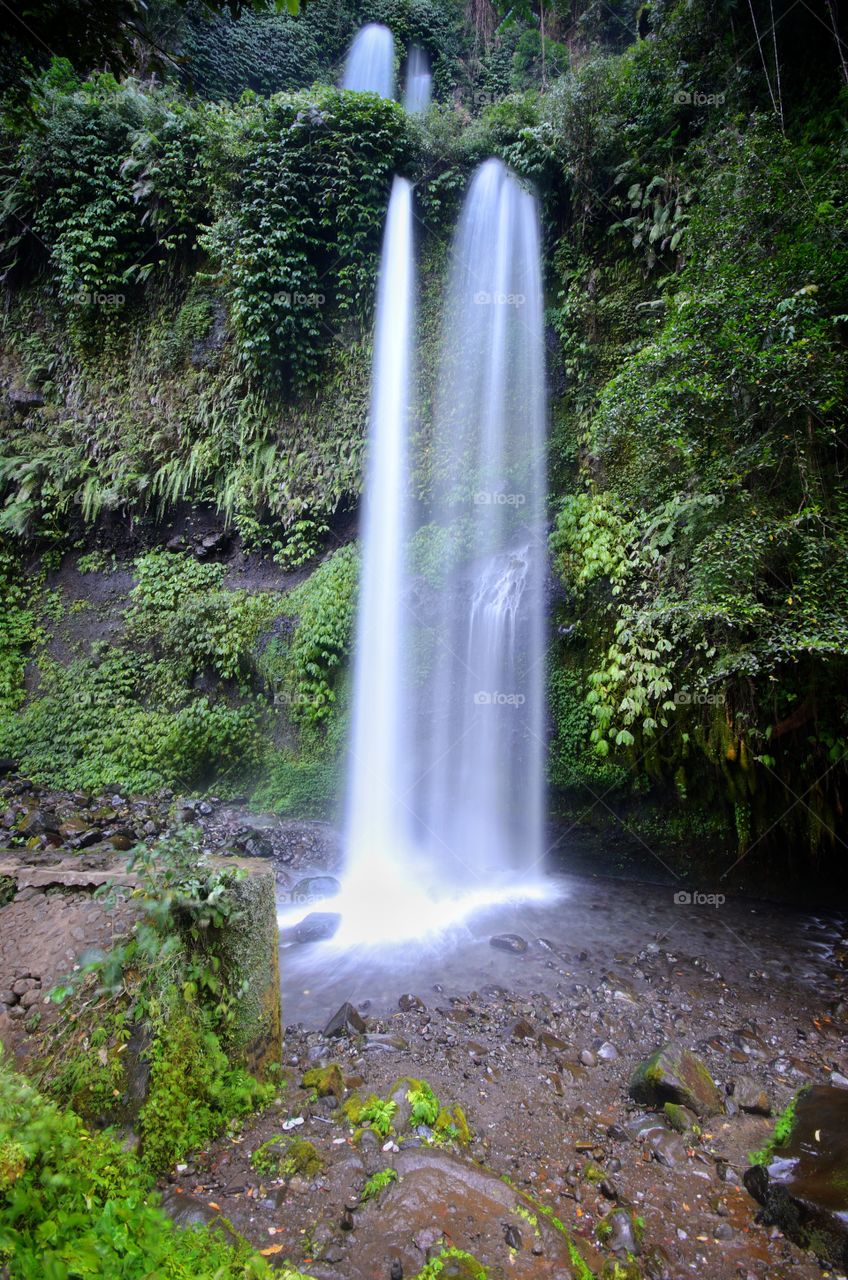 Sendang Gile Waterfall near Rinjani, Senaru Lombok indonesia. Southeast Asia. Motion blur and soft focus due to Long Exposure Shot.