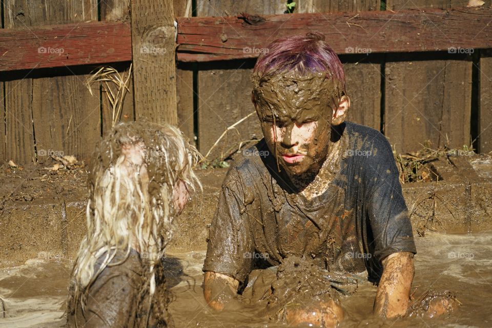 Boys Playing In Mud