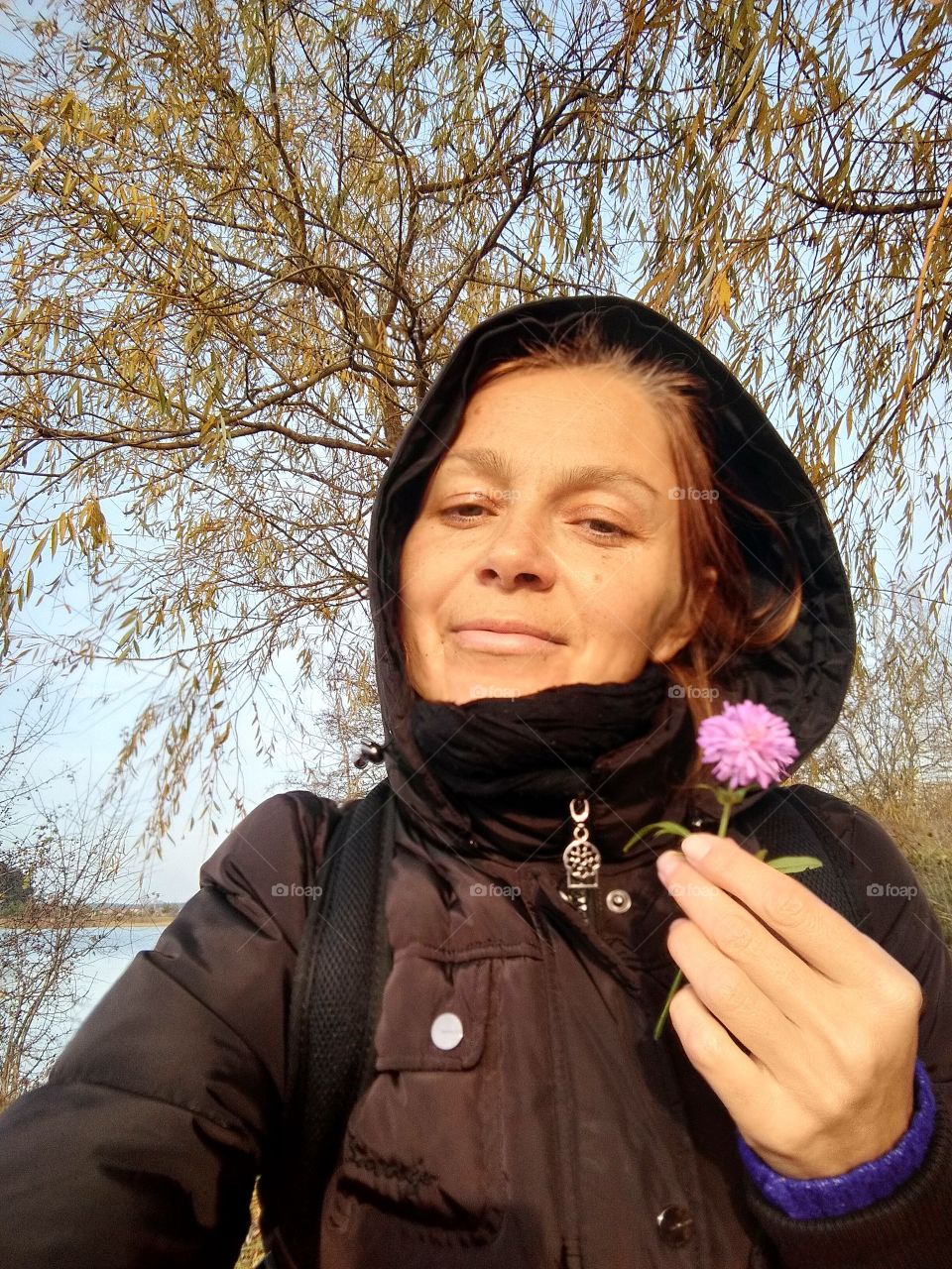 selfie girl on the nature with flower autumn time