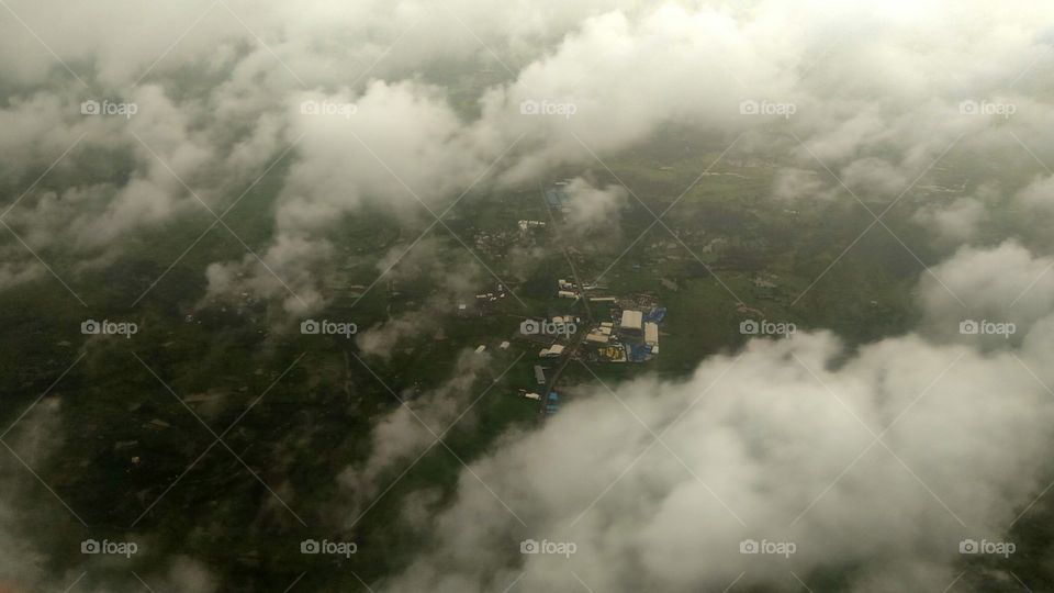Village In Middle Of Clouds