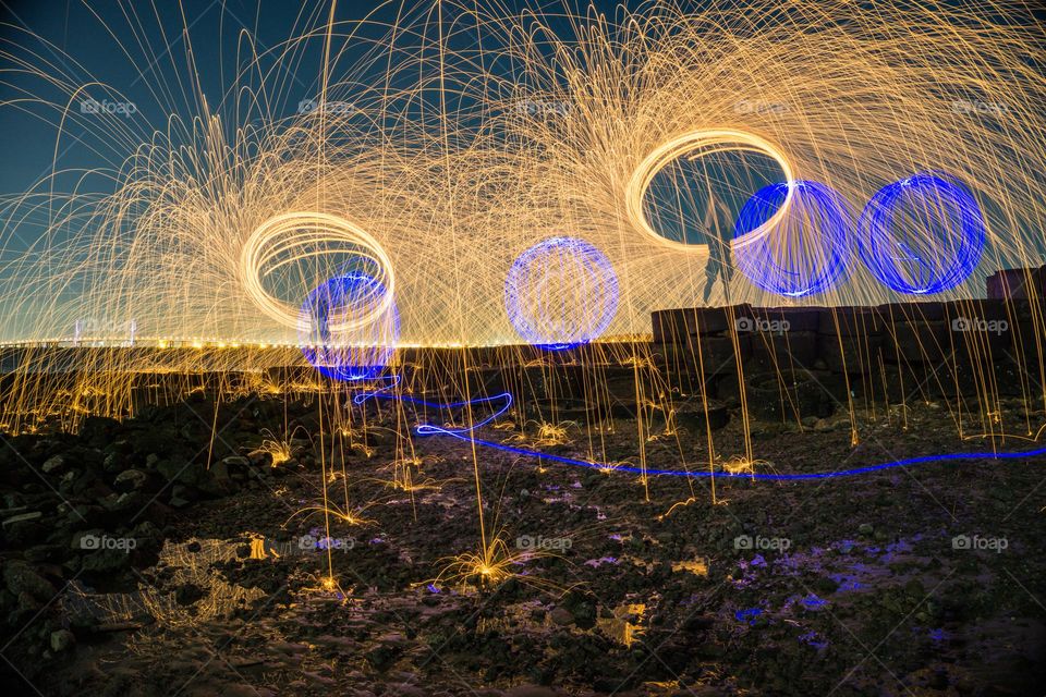 some people play with fire steelwool by twirling it while the fire is burning and forming a circular pattern