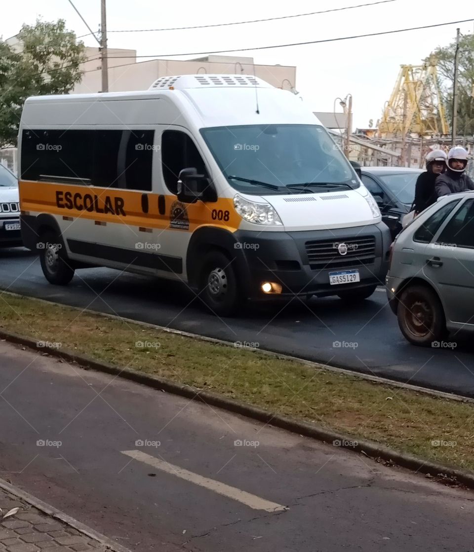 School van taking students to school in the morning