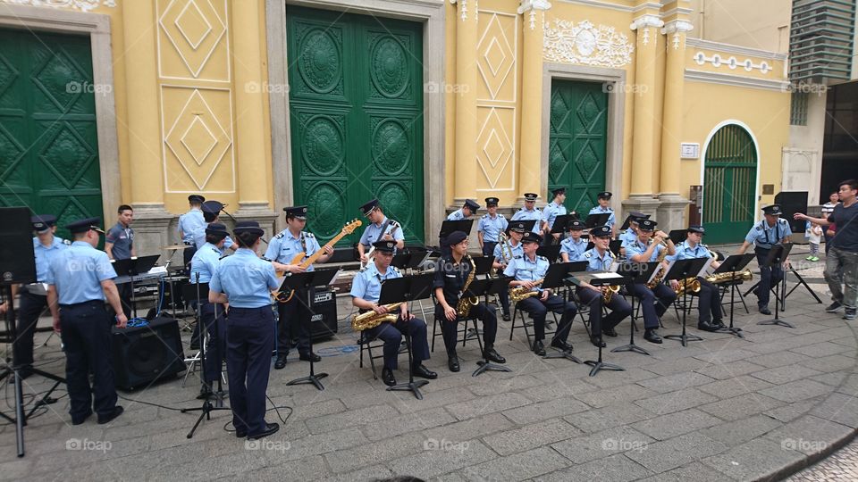 a Macau policemen and women orchestra in their free public concert/appearance as part for tourism promotion. this was held Sanmalo, a center of Macau outside the St Dominique Church, one among the Landmark.