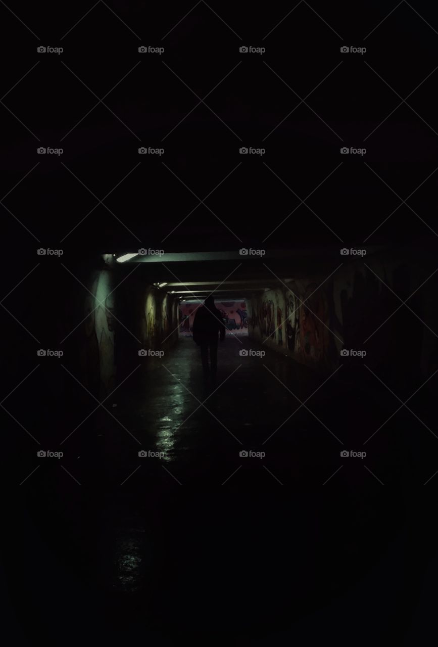 man. subway. dark. graffiti. winter.