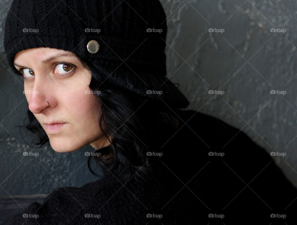 Portrait of young woman in black