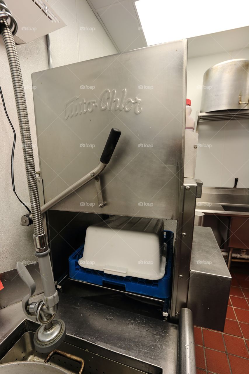 Kitchen storage cleaning equipment inside the restaurant 