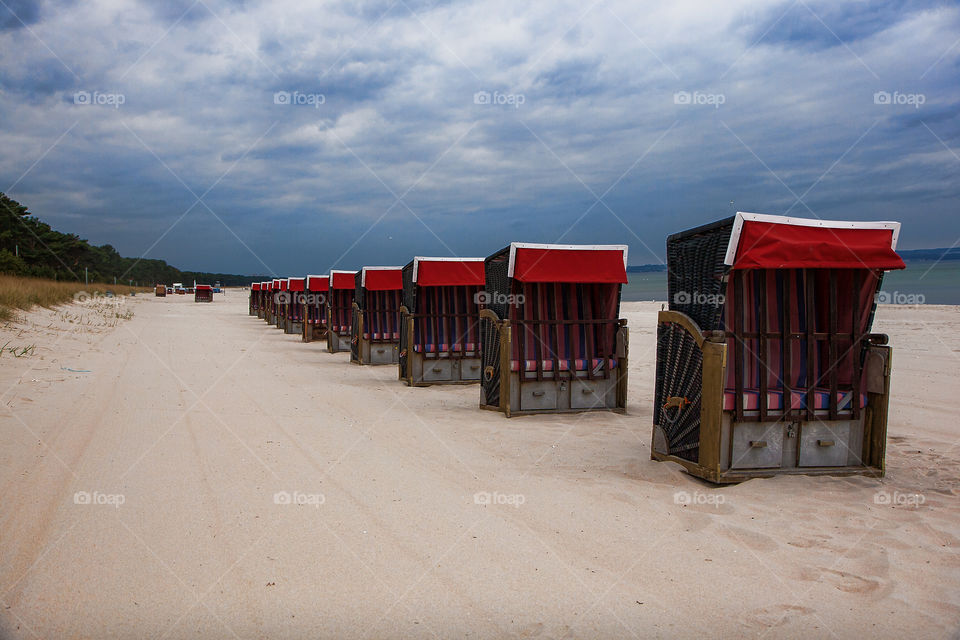 still waiting. empty beach chairs at empty beach