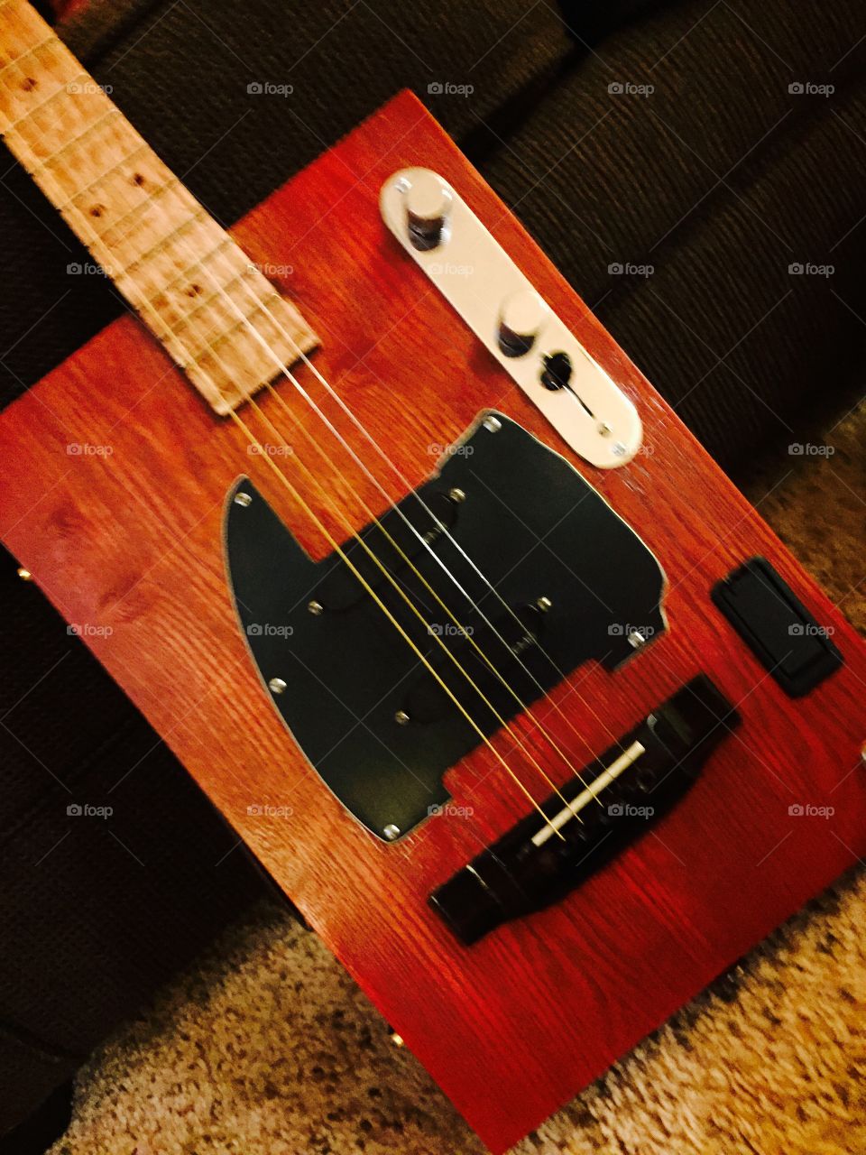 Five strong wooden electric guitar.