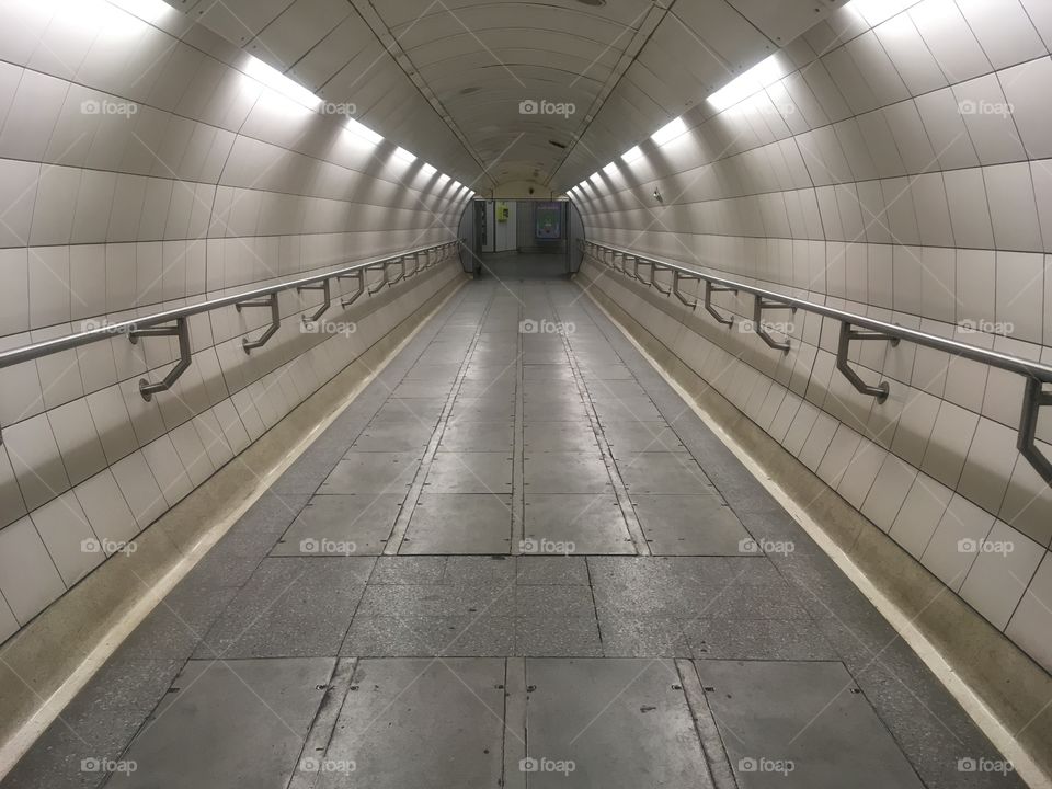 Passenger subway tunnel linking the Jubilee and Bakerloo Line platforms at Waterloo Underground Station, London. Shot in Winter.