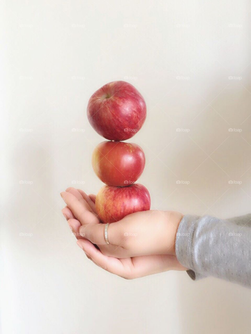 Holding red gala apples in my hand 