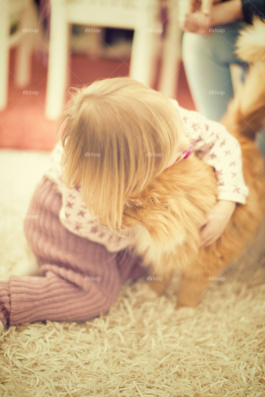 Hugging a cat