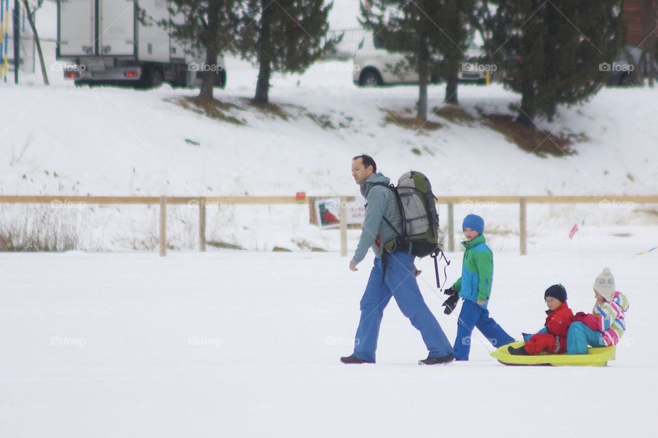 Family Walk On The Snow