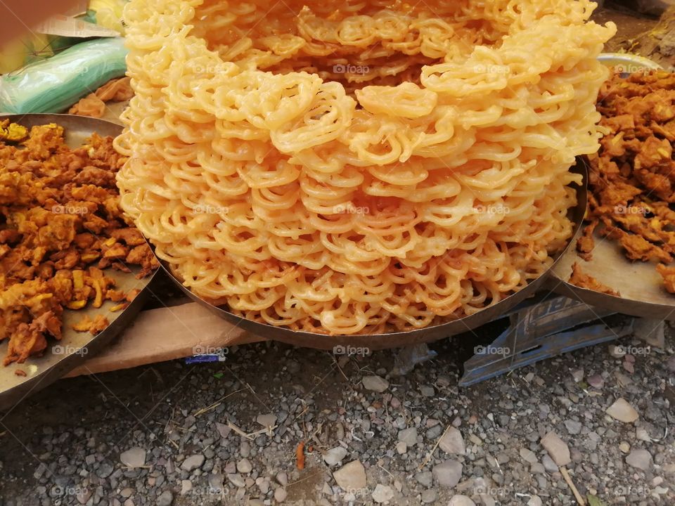 Indian tradional sweet jalebi or jelebi, round and spiral shape. Commonly called as street sweet. Sometimes serve with milk to guest or special occasion or festival.