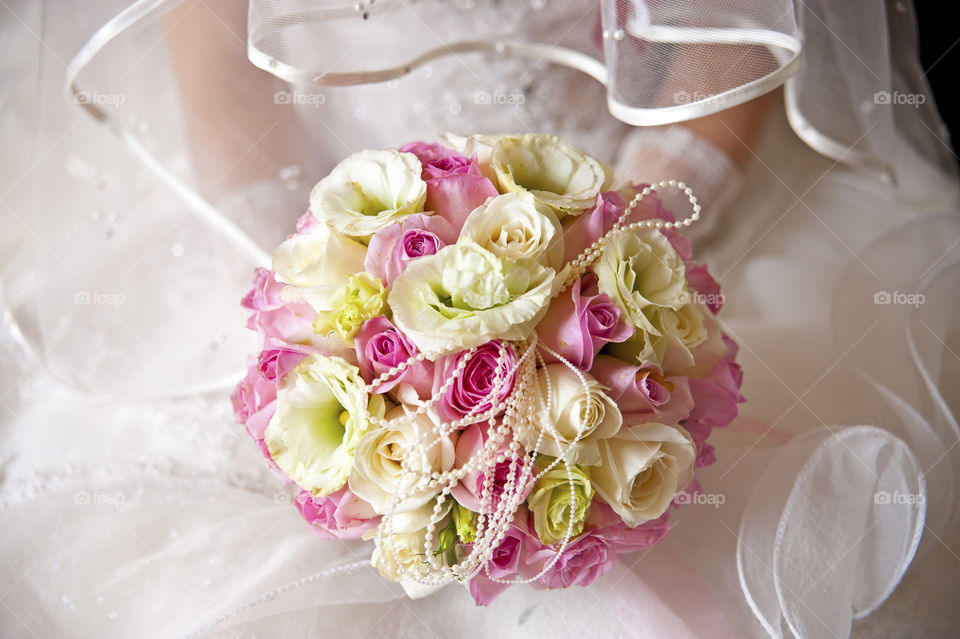 Close-up bride holding flowers