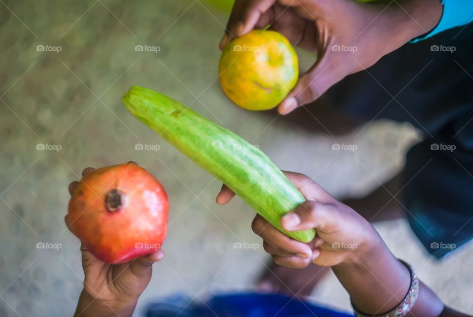 Hand holding various raw food