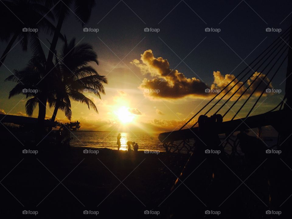 Sunset in Fiji.. Palm trees, hammocks and the sunset in Nadi, Fiji.