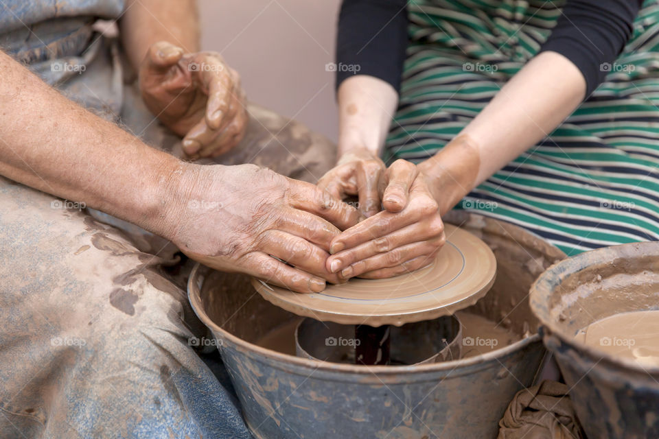 Pottery making. Closeup on hands.