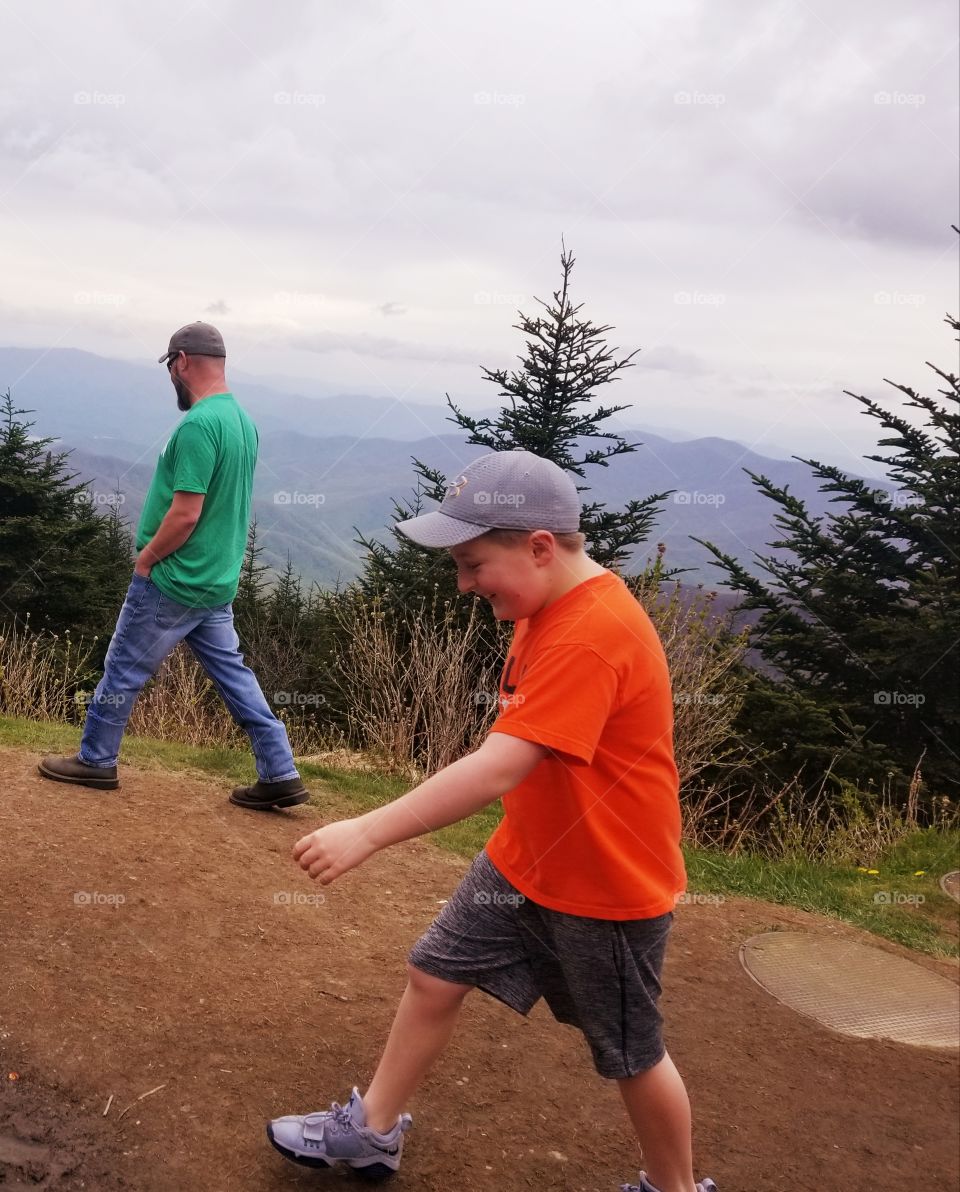 After you dad, having fun following in his footsteps with panoramic mountain views, Smoky Mountains National Park.