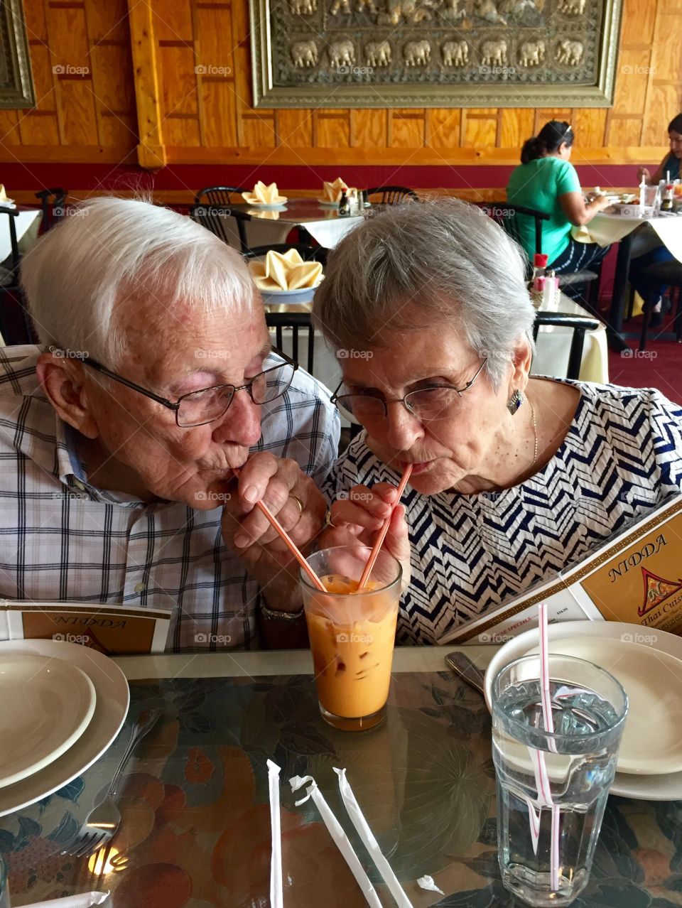 Senior couple drinking juice in restaurant