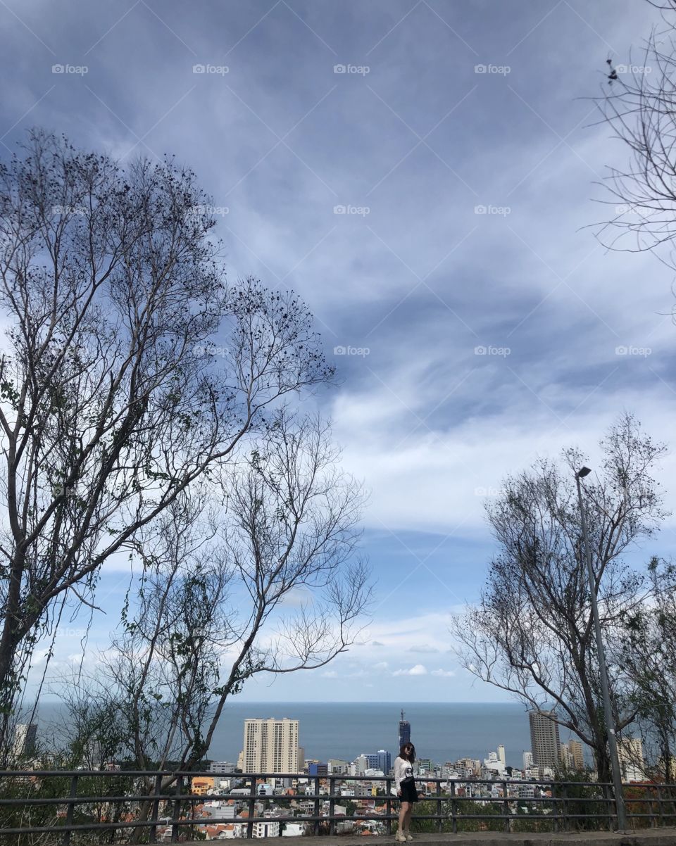 The view on the hill and below is Vung Tau beach in Vietnam