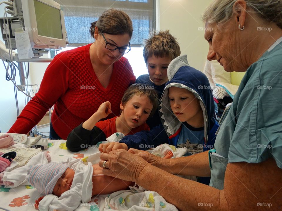 Premature Newborn Infant With Family In The Hospital

