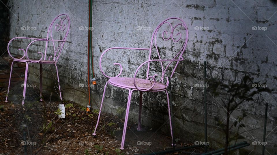 pink chairs in the old garden