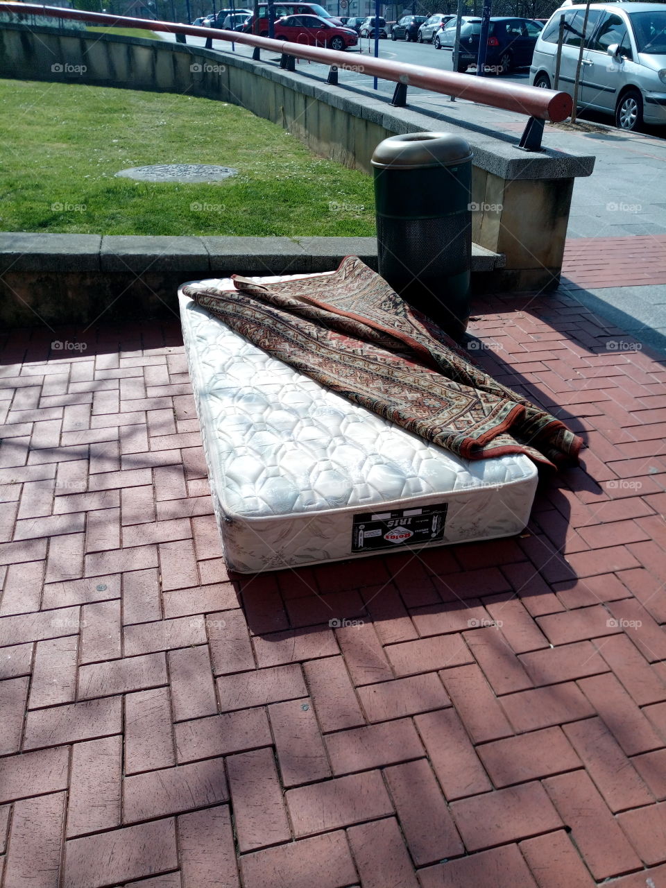 mattress with carpet on the street