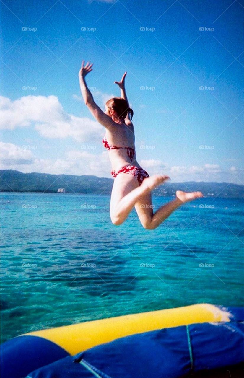 Jumping off a ocean trampoline in Jamaica 