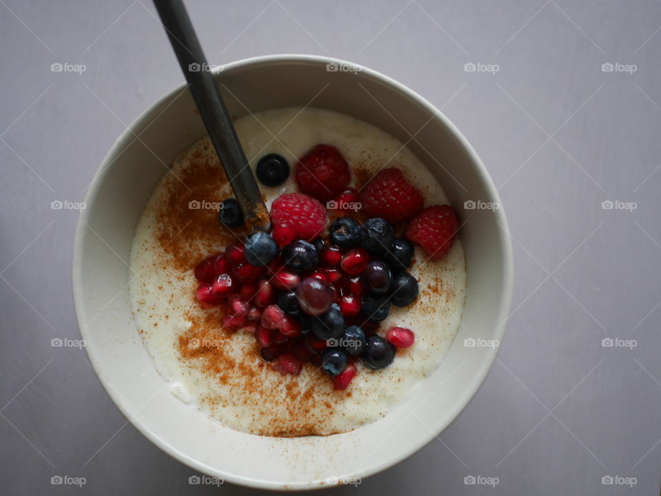 Spoon in a full breakfast bowl 