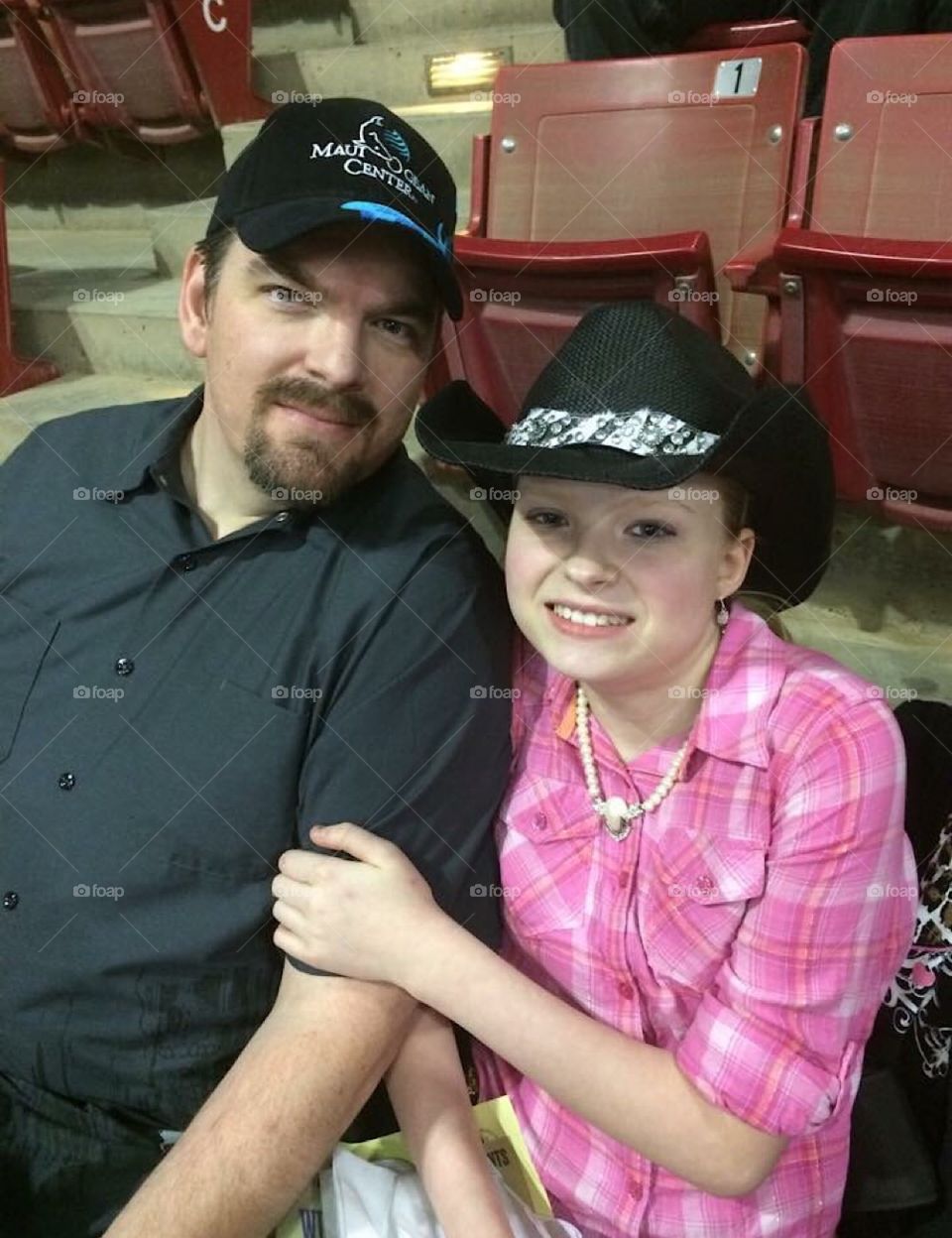 My lil’ cowgirl with her dad at the rodeo!