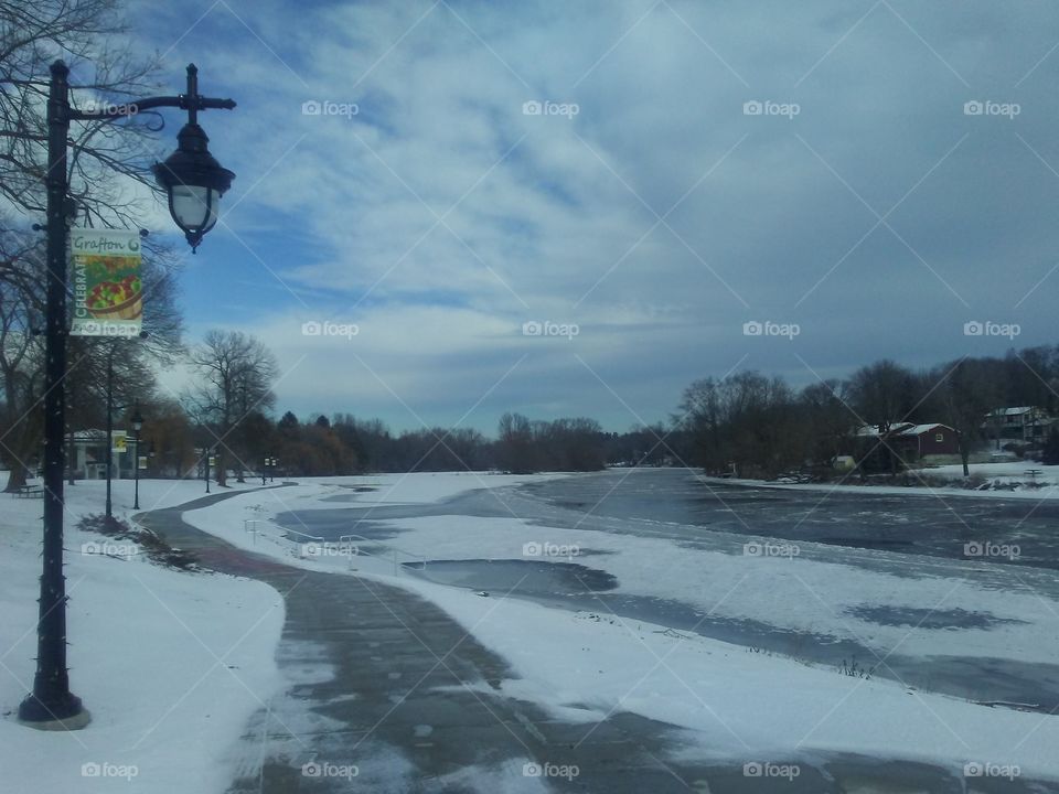 Frozen Milwaukee River by Veterans Memorial Park by downtown Grafton, Wisconsin just 20 miles North of downtown Milwaukee.