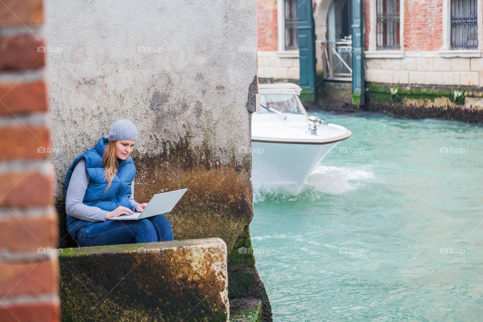 workplace . girl working at a laptop on the street