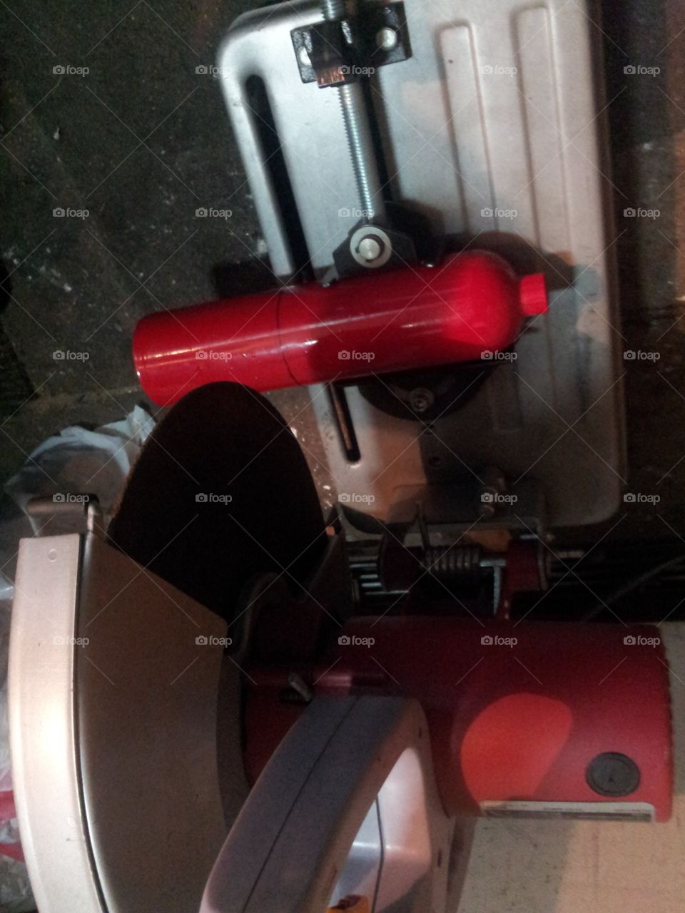 Cutting a fire extinguisher in half
