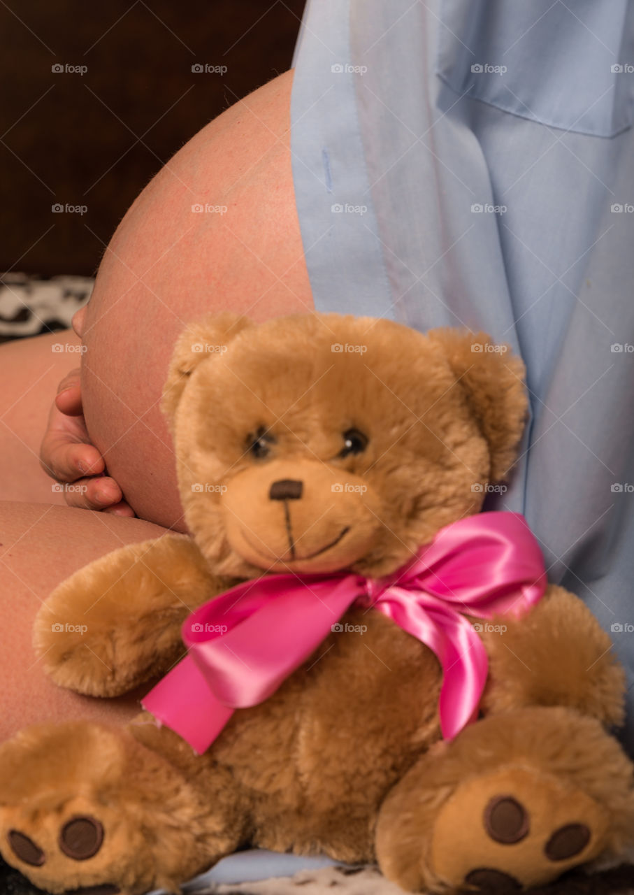 Expecting mother with Teddy bear