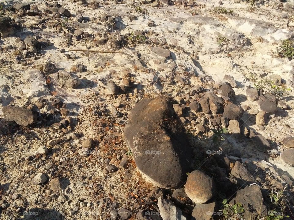 A beautiful scene of stones in the hill's edge.
