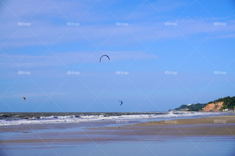 Kitesurfers at the beach in São Luís, Brazil