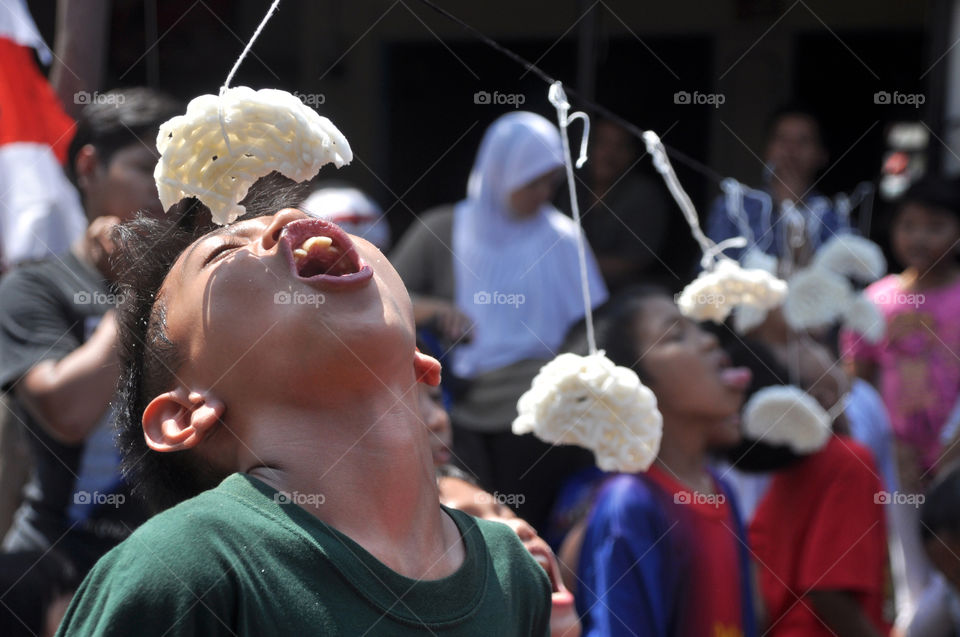 Cracker eating competition at Indonesia Independence Days celebrations