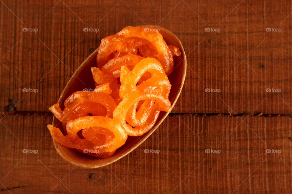 Indian traditional sweet Jalebi in a pottery bowl