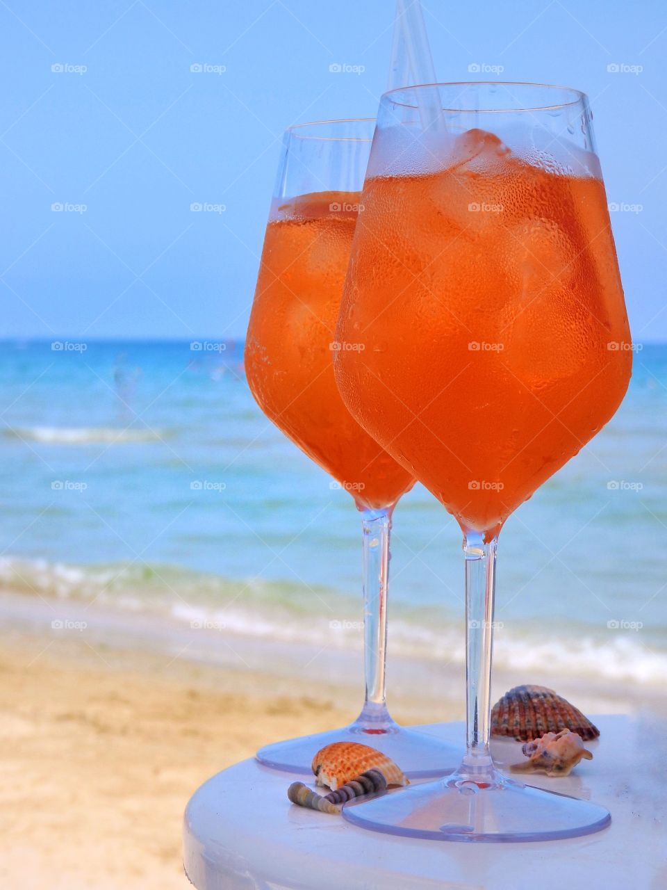 A refreshing drink in glasses on the beach in summer