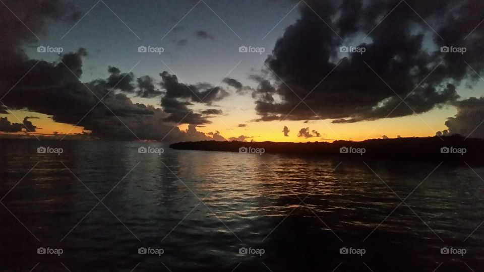 amazing sunset behind small island