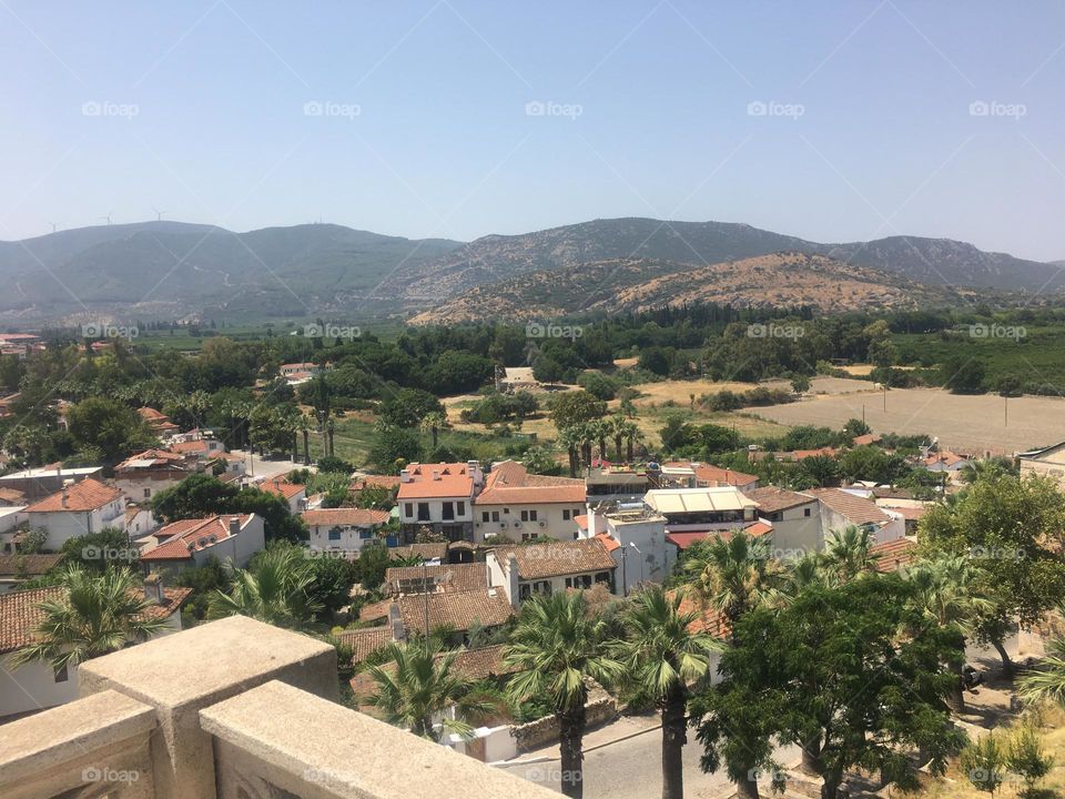 Sightseeing in Turkey. Blue sky and tall palm trees. Sunsets and sunny days. Summertime in Kusadasi. Vacation travel in Turkey . Summer view. Sunny day during vacation. Hidden gems and secret places.