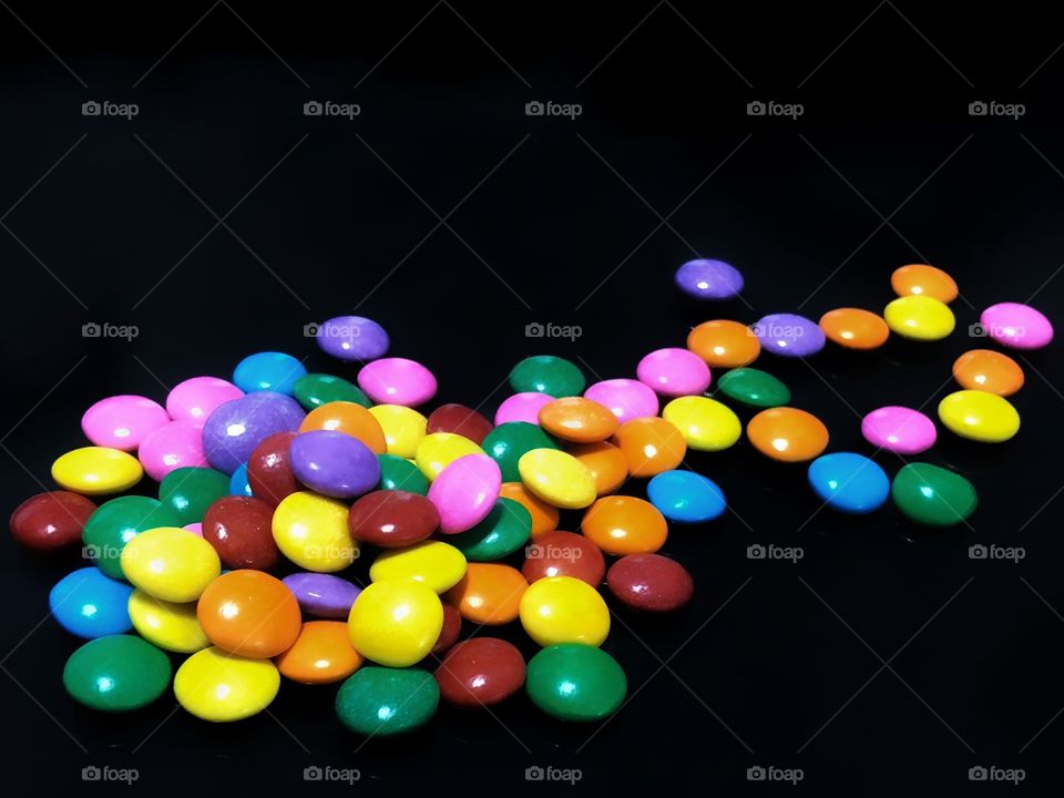 Colorful and delicious! Impossible to eat just one: colorful button-shaped chocolates... 